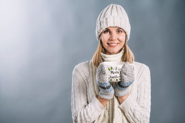 Woman Holding Cup Mockup With Christmas Concept Psd