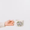 Woman Holding Cup Mockup With Christmas Concept Psd