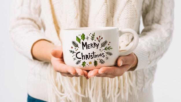 Woman Holding Cup Mockup With Christmas Concept Psd