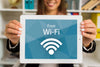 Woman Holding Digital Tablet With Wi-Fi Lettering Psd