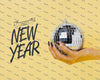 Woman Holding Disco Ball With New Year Lettering Psd