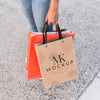 Woman Holding Mock-Up Shopping Bags Psd