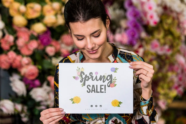 Woman Holding Paper Mockup For Spring Sale Psd