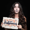 Woman Holding Paper With Halloween Lettering Psd