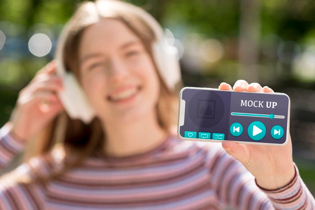 Woman Holding Phone With Music App Mock-Up Psd