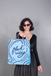Woman Holding Shopping Bag Mockup With Black Friday Concept Psd