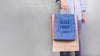 Woman Holding Shopping Bag Mockup With Black Friday Concept Psd