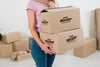 Woman Holding Two Moving Boxes Mock-Up Psd