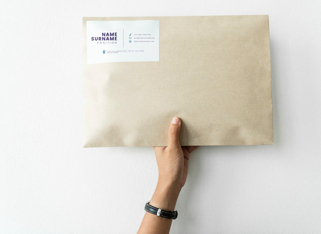 Woman Holding Up A Package Mockup Psd
