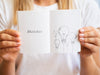 Woman Holding Up A Sketch Book Mock-Up Psd