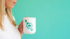 Woman Holding Up A White Coffee Mug With Copy Space Psd