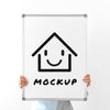 Woman Holding Up Whiteboard Mock-Up Psd