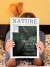 Woman In Bed Showing A Nature Magazine Psd