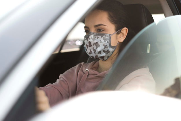 Woman In Car Wearing Mask Psd