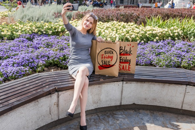 Woman In City With Black Friday Bags Psd