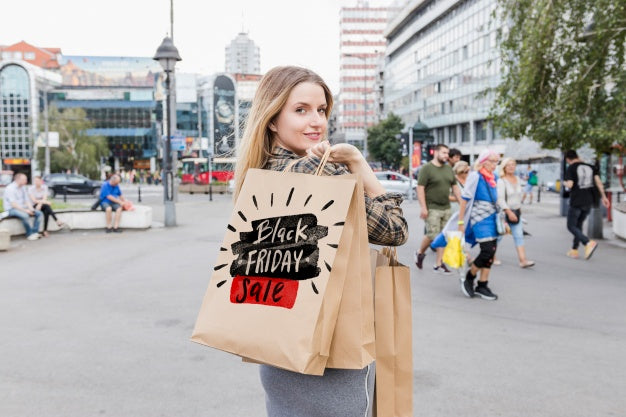 Woman In City With Black Friday Bags Psd