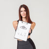 Woman In Gym Clothes Holding Notepad Psd