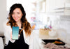 Woman In Kitchen Presenting Smartphone Mockup Psd