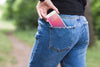 Woman In Nature With Smartphone In Pocket Psd