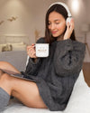 Woman Listening To Music On Headphones While Holding A Mug Mock-Up Psd