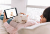 Woman On Couch With Cat And Tablet Mockup Psd
