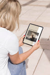 Woman On Street Reading Book On Tablet Psd