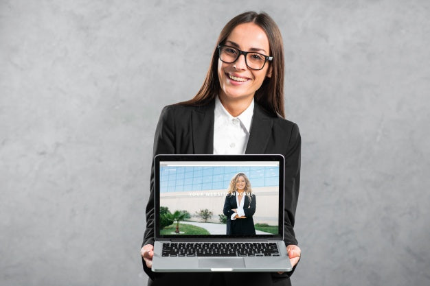 Woman Presenting Laptop Mockup Psd