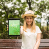 Woman Presenting Tablet Mockup In Nature Psd