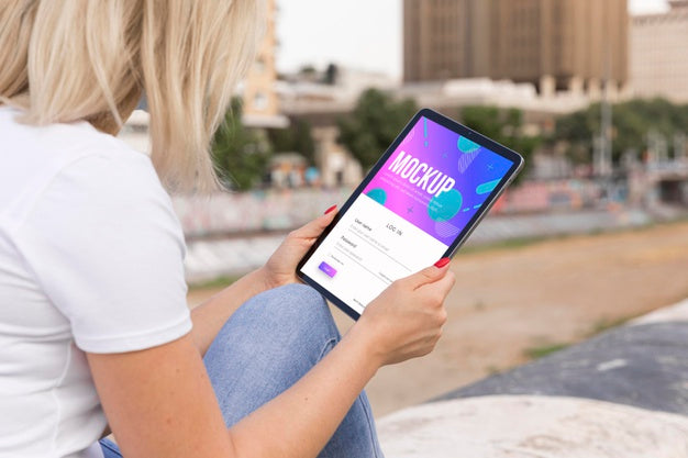 Woman Reading Book On Tablet Psd