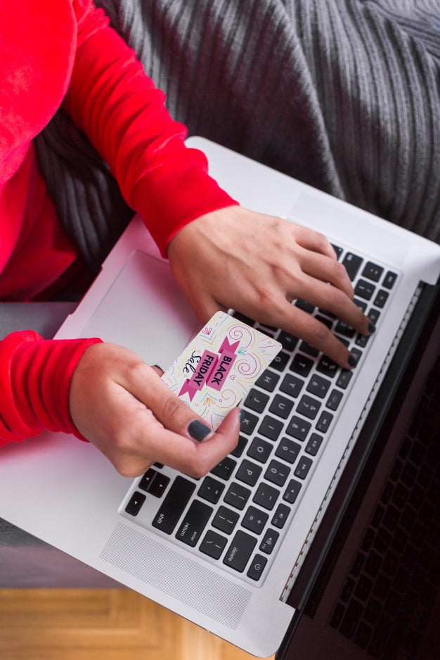 Woman Searching For Black Friday On Laptop Psd