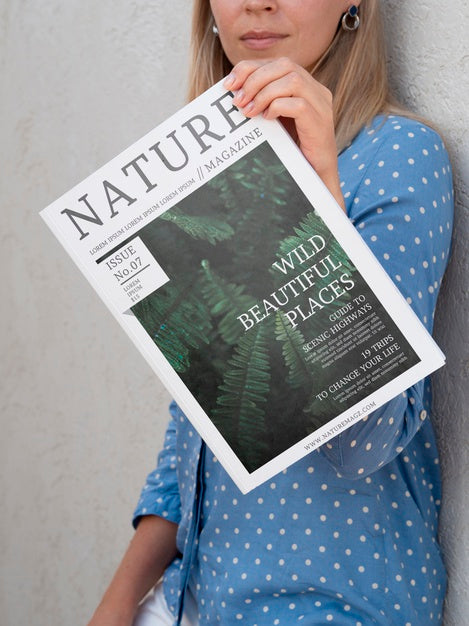 Woman Showing A Nature Magazine Mock Up Psd
