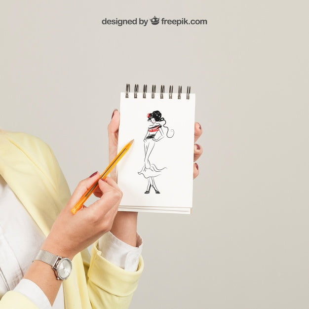 Woman Showing Drawing On Notepad Psd