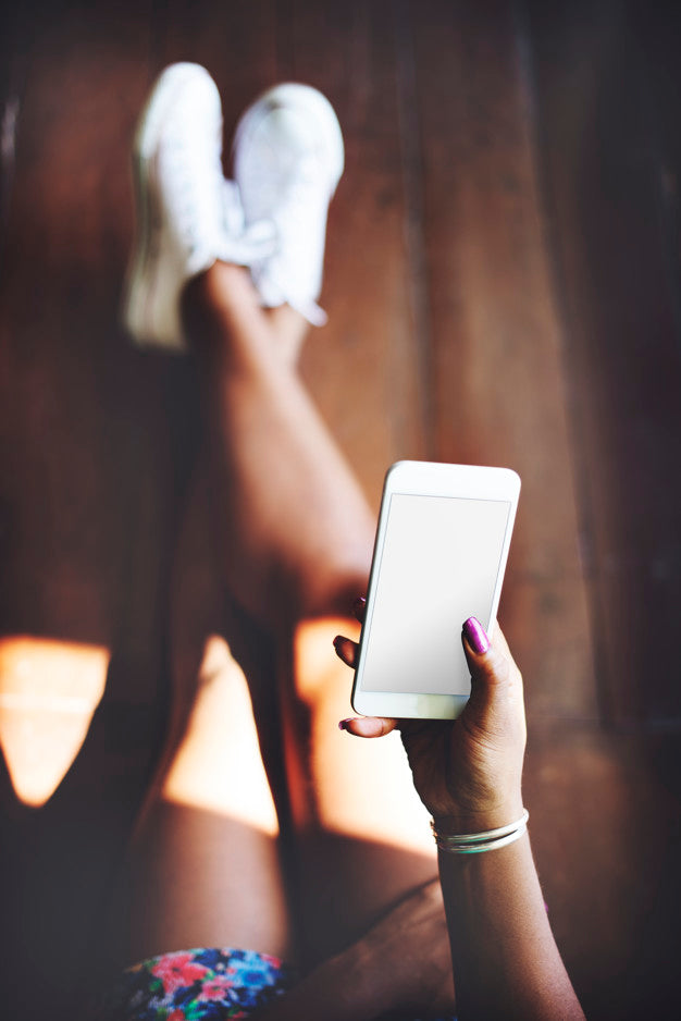 Woman Using A Smartphone With An Empty Screen Psd