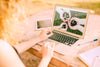 Woman Using Laptop Mockup In Nature Psd