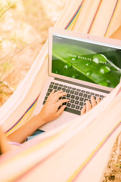 Woman Using Laptop Mockup In Nature Psd