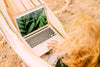 Woman Using Laptop Mockup In Nature Psd
