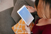 Woman Using Tablet At Home Psd