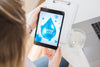 Woman Using Tablet Mockup With Water Concept Psd