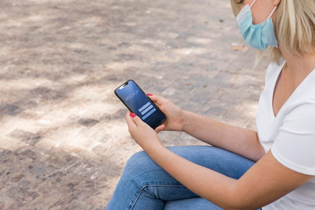 Woman Wearing Mask On Street Reading Book  On Phone Psd