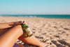 Woman With Beer Bottle Mockup At The Beach Psd