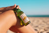 Woman With Beer Bottle Mockup At The Beach Psd