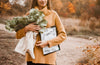 Woman With Clipboard Mockup And Flowers Psd