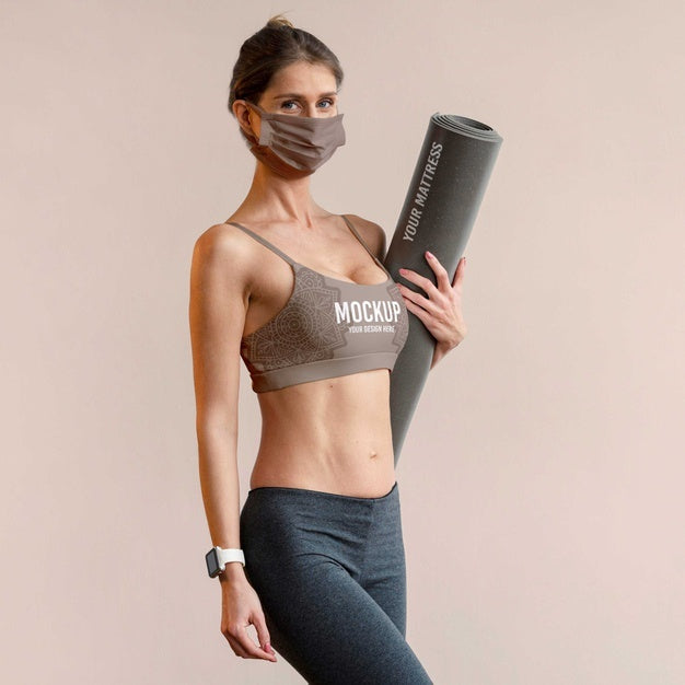 Woman With Face Mask Holding Yoga Mat Psd