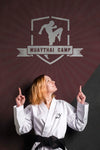 Woman With Karate Black Belt Pointing The Mock-Up Logo Psd