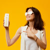 Woman With Sunglasses Pointing At Milk Psd