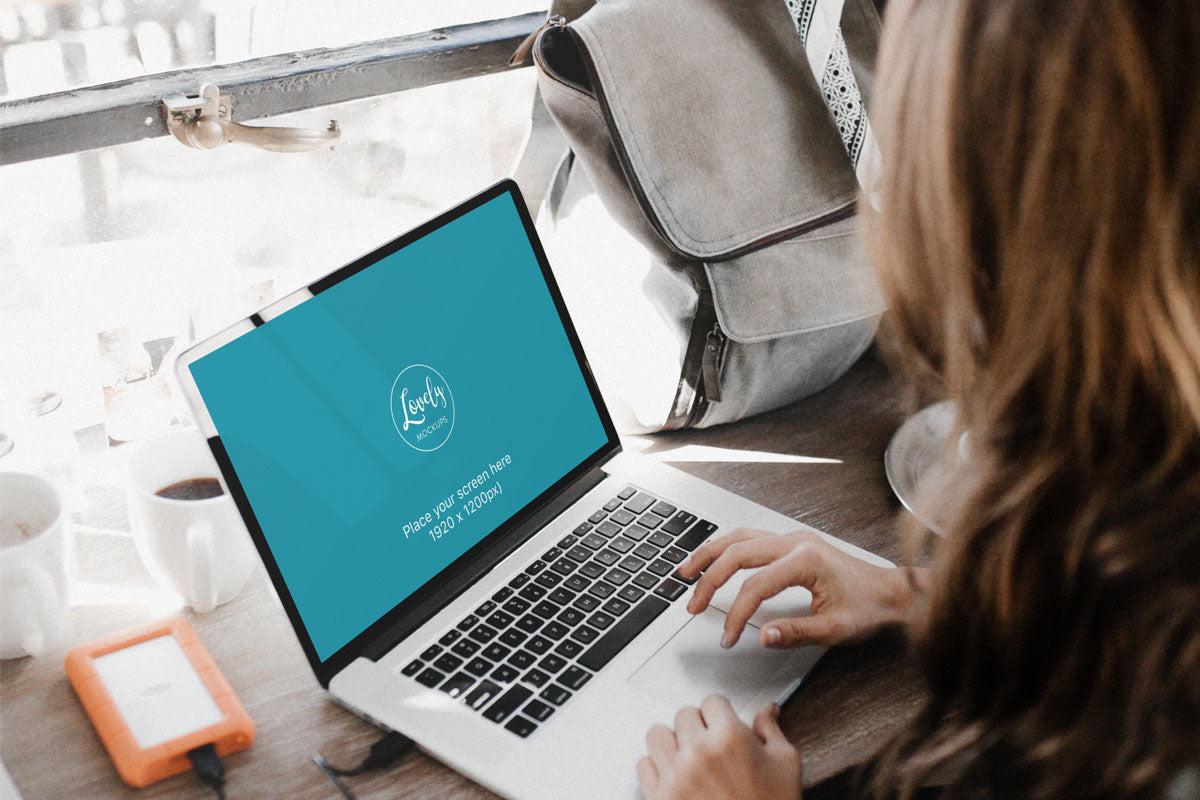 Young Woman Working On Her New Macbook Pro PSD Mockup