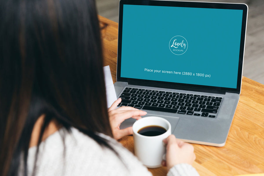 Woman Working on a 15 Inch Macbook Pro