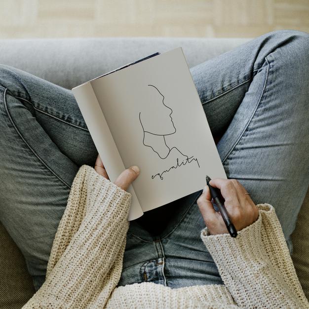 Woman Writing Equality In A Notebook Mockup Design Psd