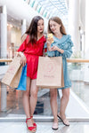 Women Holding Shopping Bags In Mall Psd