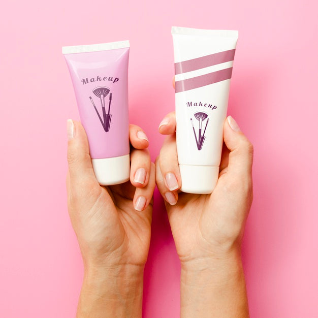 Women Holding Up Hand Cream Bottles Mock-Up Psd